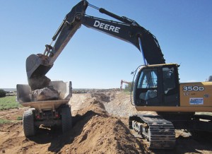 Removing boulders to allow trenching for utilities